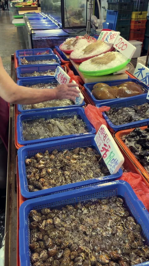 Baskets Of Live Shellfish Lining A Busy Seafood Market Aisle Stock Footage 344235696