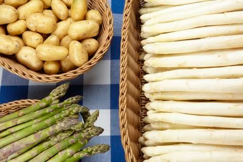 Baskets of sparrowgrass and potatoes Stock Photos