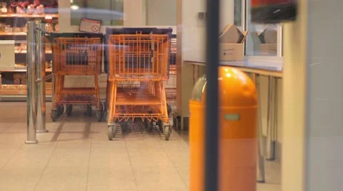 A baskets in supermarket through automatic doors Stock Footage 56937933