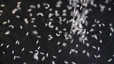 Basmati rice is poured onto stone surface. Slow motion Stock Footage 80325387