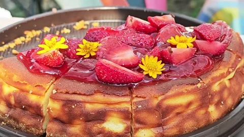 Basque burnt cheesecake with fresh strawberries. 스톡 동영상 339780769