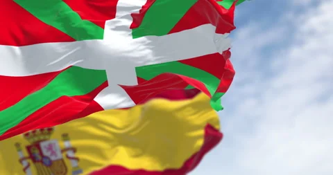 Basque Country and Spanish flags waving in the wind Stock Footage 322180965