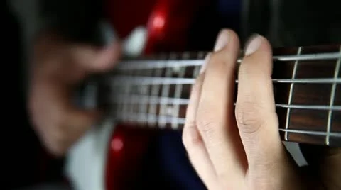 Bass guitar player close up playing slap technique Stock Footage