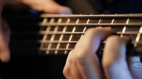 Bass guitar player practicing - closeup Stock Footage 35910621