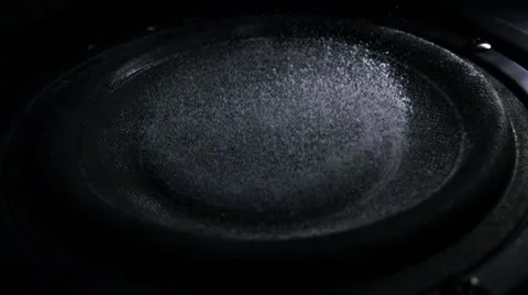 Bass loud speaker throws dust in the air. Super slow motion. Equalizer concept Stock Footage 60970713
