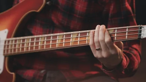 Bass Player Close Up Playing Tilt Up to Face Stock Footage 89511482