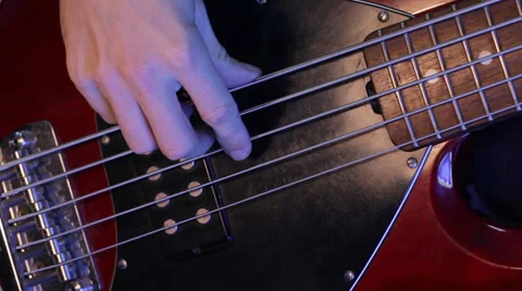 Bass player playing five string electric bass Stock Footage 35908212