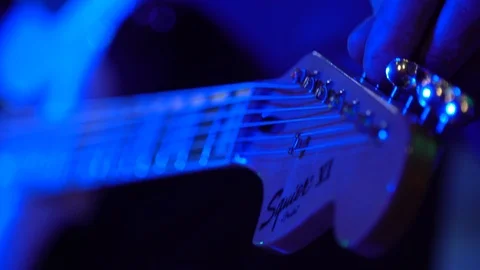 Bass Player Practicing Under Colored Stage Lights Stockbeeldmateriaal 94101203