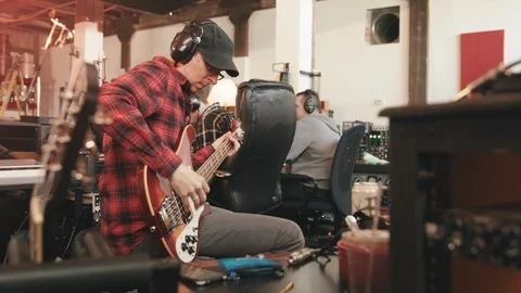 Bass Player Side Angle Wide at Recording Session Stock Footage 89511508