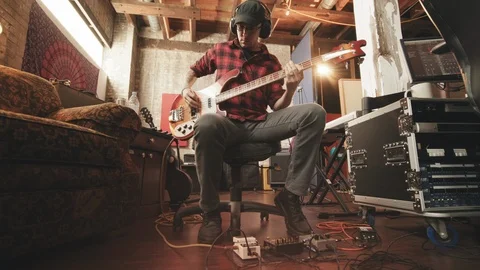 Bass Player Sitting in Recording Studio Move In Stock Footage 89511465