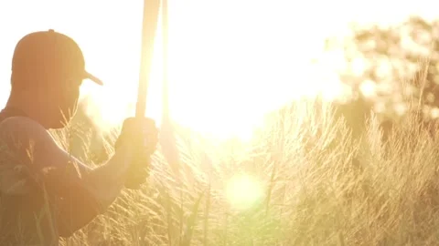 The bassist is practicing baseball bat catching with the sunset Stock Footage 133120435