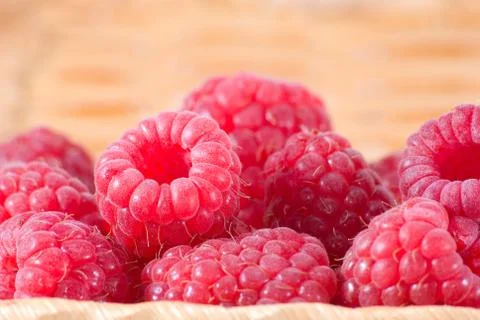 Bast-basket with a raspberry Stock Photos