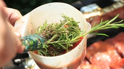 Basting meat on BBQ Stock Footage 40750383