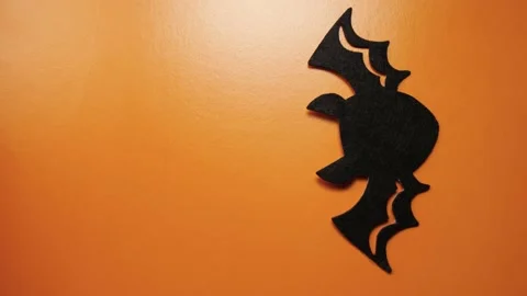 Bat figures moving on an orange background Video stock 211123750