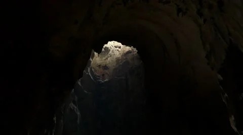 Bat flying under cave ceiling gap, with sounds Stock Footage 50571697