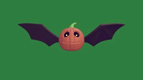 A bat on green background and flying through screen pumpkin with it ' s back Stock Footage 336971154