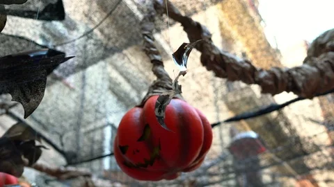 Bat made from a plastic bottle and a street lamp in the shape of a pumpkin Stockbeeldmateriaal 114325903