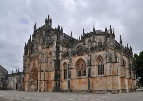 Batalha Monastery, cloudy sky, front entrance to the building Stock Photos