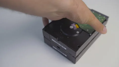 A batch of new hard disk drives. Man sells four new HDDs Video stock 155320842