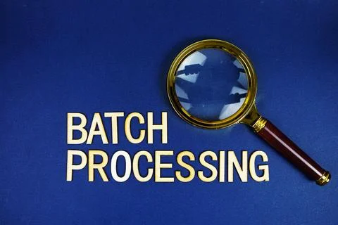 Batch Processing alphabet letters with magnifying glass on navy blue backgrou 库存照片