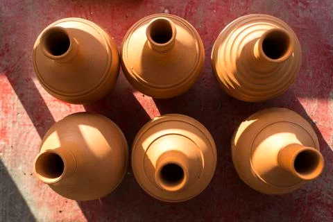 Batch of traditional handmade bottle design from raw clay material Stock Photos