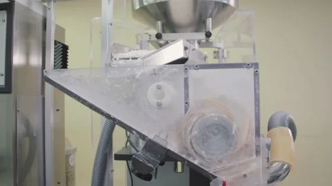 Batches of pills are falling down to automated sorting machine. drug production Stock Footage 200856574