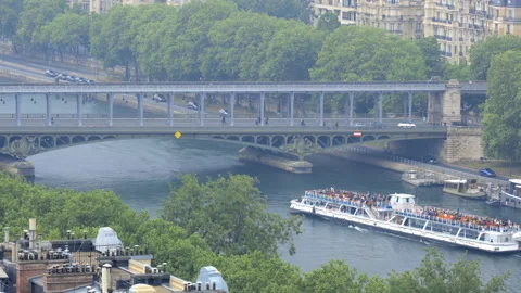 Bateau passing under the Bir Hakeim bridge in Paris France in Paris, France Stock Footage 200181925