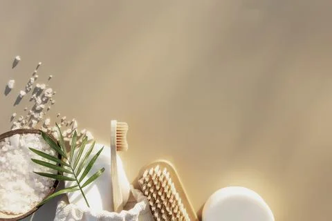 Bath accessories flat lay on beige background with sun shadow effect. Healthcare Stock Photos