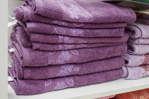 Bath accessories. A stack of new towels. Textile industry. Retail trade Stock Photos