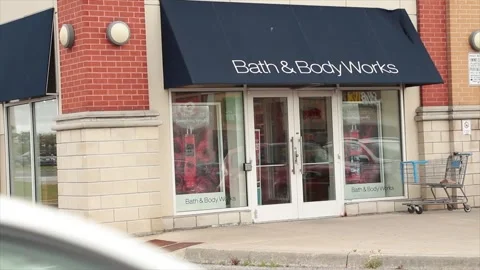 Bath and body works store storefront entrance with customers people entering Stock Footage 252035199