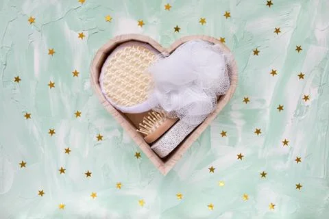 Bath and spa kit on festive green background Stock Photos