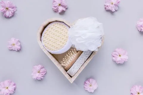 Bath and spa kit on pink floral background Stock Photos