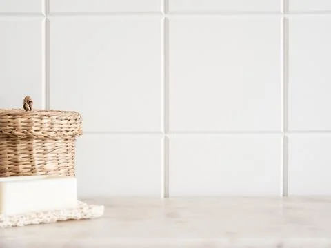 Bath background front view with straw box and white soap on white marble shel Stock Photos