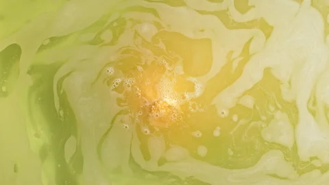 Bath bomb ball dissolves in water with white foam bubbles. Cosmetic product Stock Footage 253776574