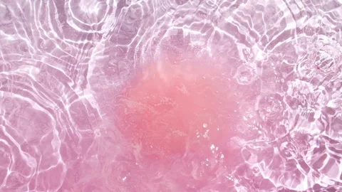 Bath bomb ball dissolves in water with white foam bubbles. Cosmetic product Stock Footage 274637662