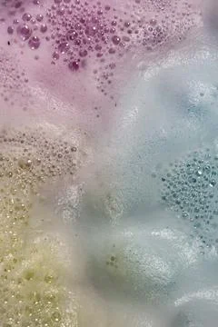Bath bomb bubbles and foam create organic background plate Stock Photos