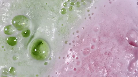 Bath bomb bubbles expand and multiply creating bizarre graphic element Stock Footage 334053238