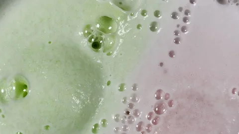 Bath bomb bubbles expand and multiply creating surreal graphic element Stock Footage 334053366