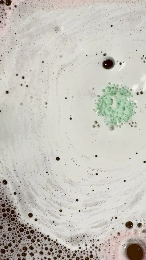 Bath bomb fizzes and emits bubbles to create graphic element Stock Footage 334762907