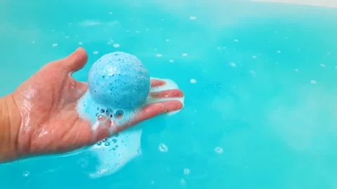 Bath bomb, round salt sphere to dissolve in water, bathing,hygiene,bubbling ball Video stock 313056108