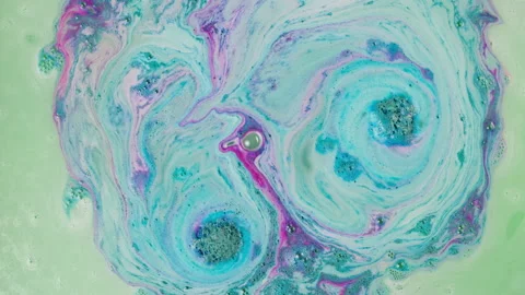 Bath bomb in water close-up. Soap ball dissolving, foam bubbles. Decorative Stock Footage