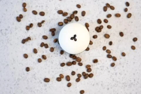 Bath bombs with coffee grains on a white background Stock Photos
