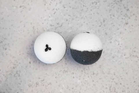 Bath bombs with coffee grains on a white background Stock Photos