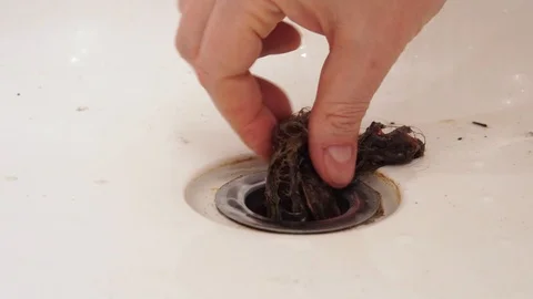 Bath clogging concept. Water drain is clogged with hair. 스톡 동영상 126658332