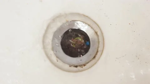 Bath clogging concept. Water drain is clogged with hair. Stock Footage 130852807