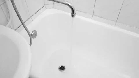 The bath is filled with a stream of water. white 4k footage Stock Footage 155958959