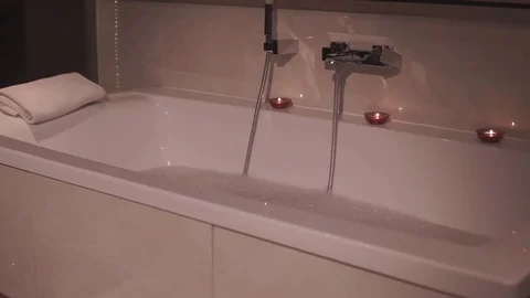 Bath with foam and scented candles Stock Footage 74674969