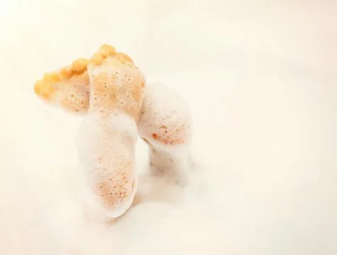Bath foam. baby hands in bubble bath, baby washing in bubble bath Stock Photos