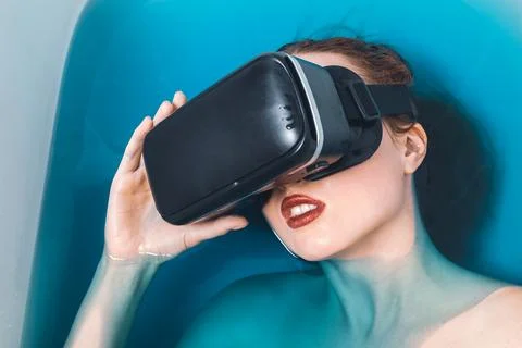 In bath with a gadget Stock Photos