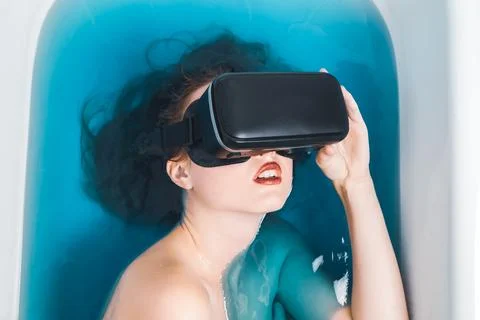 In bath with a gadget Stock Photos